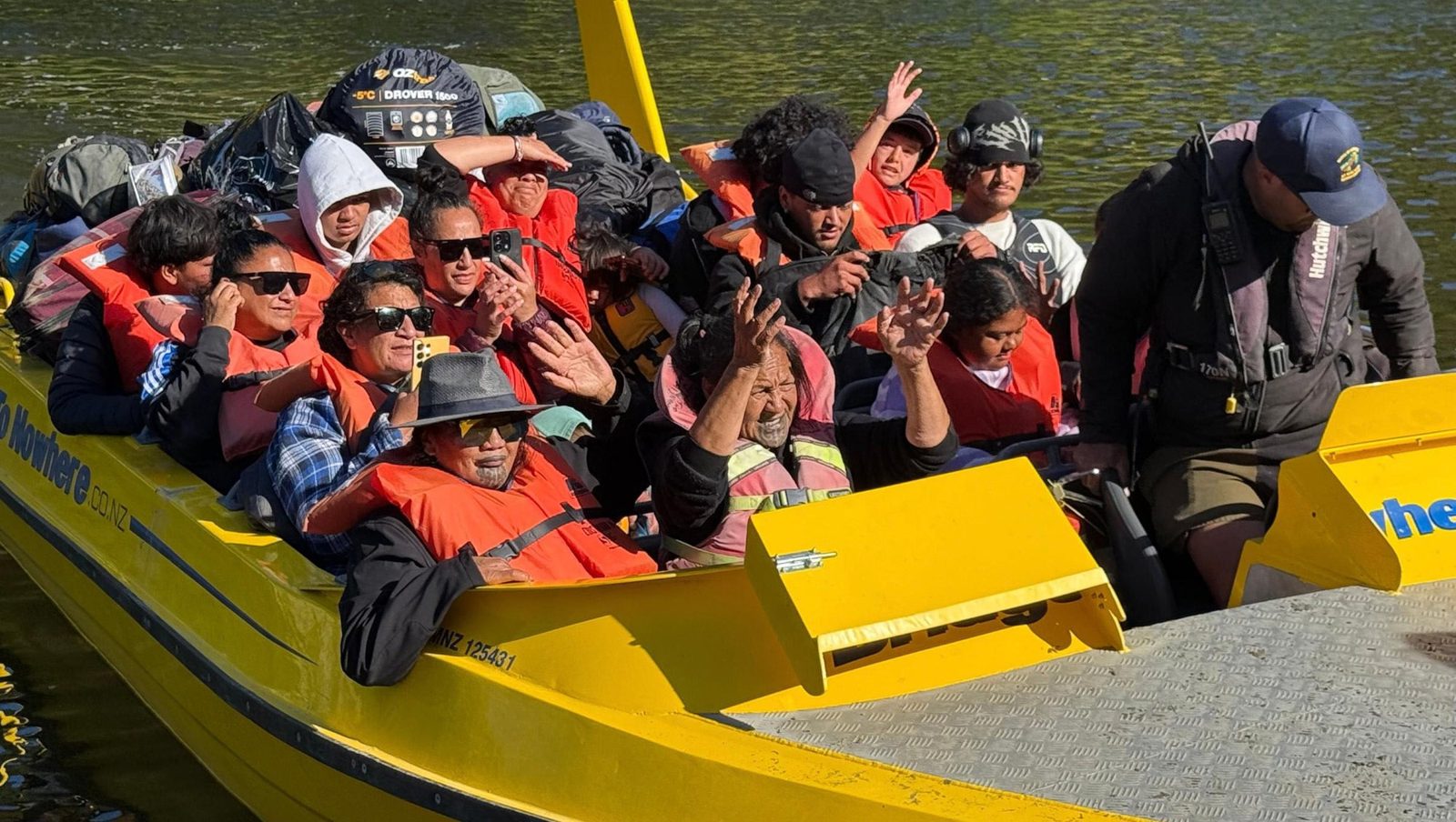 Tamariki and whānau on the jetboat to Tieke