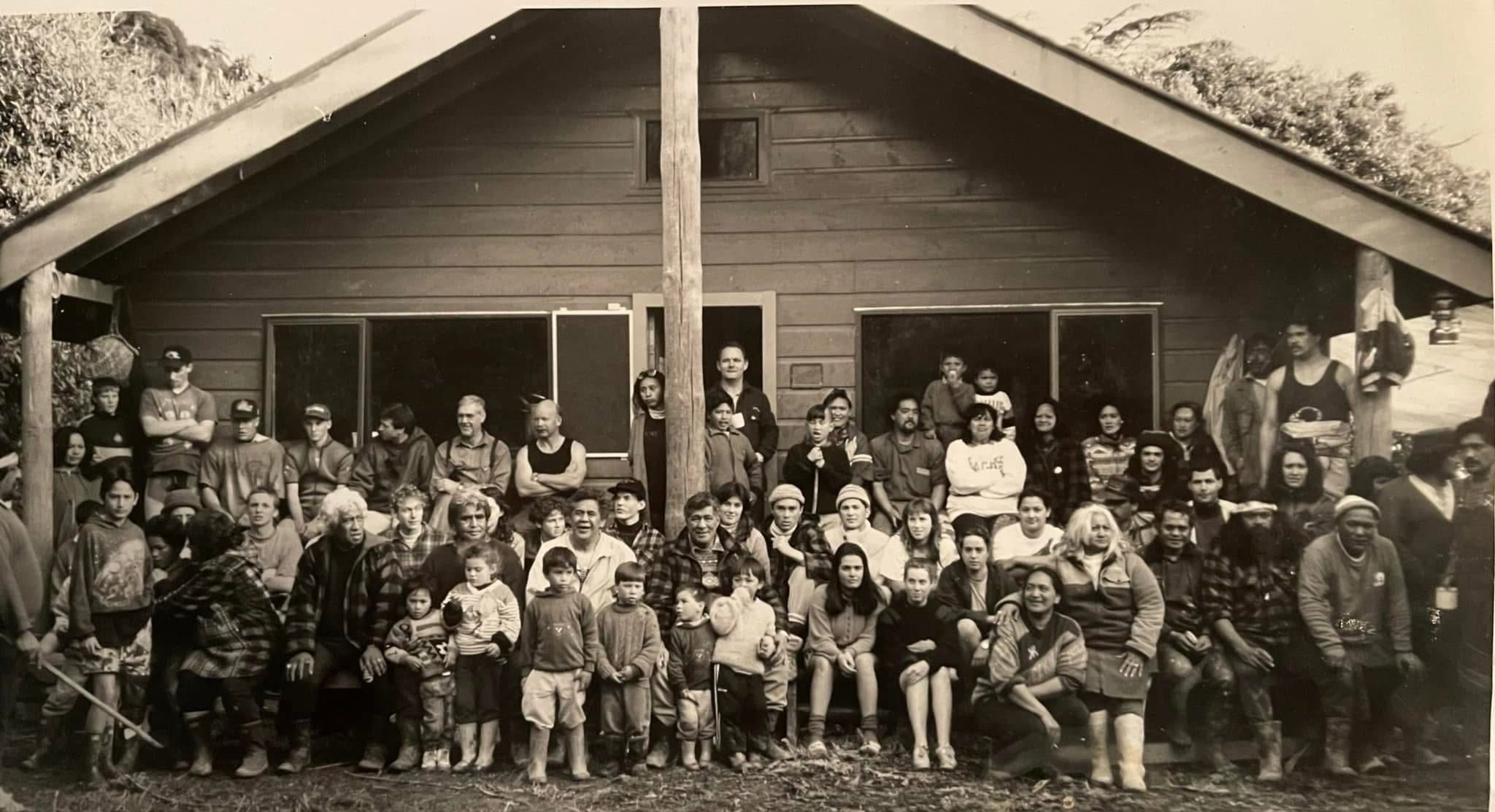Whānau gathered in front of the whare at Tieke during the occupation